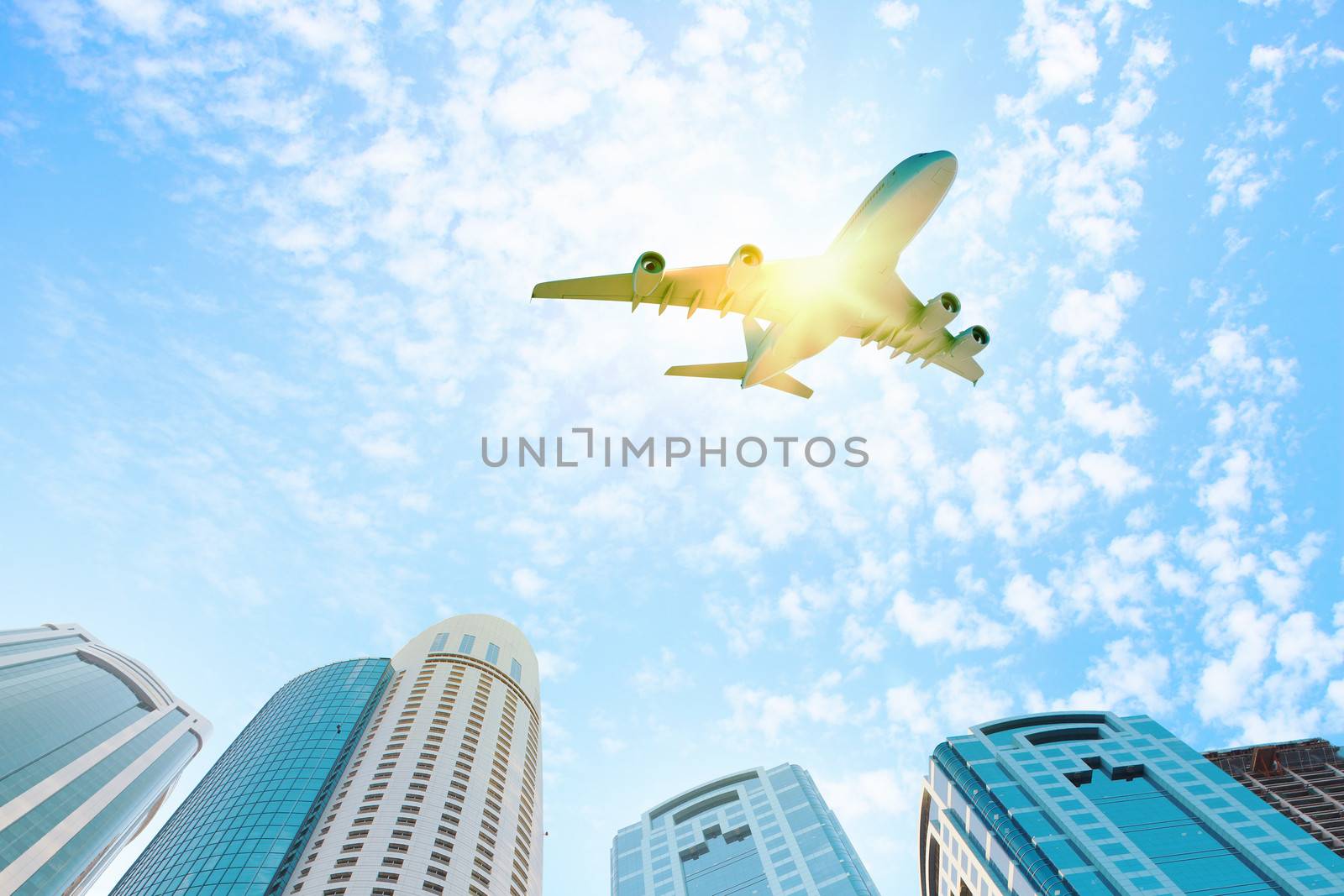 Airplane above city by sergey_nivens