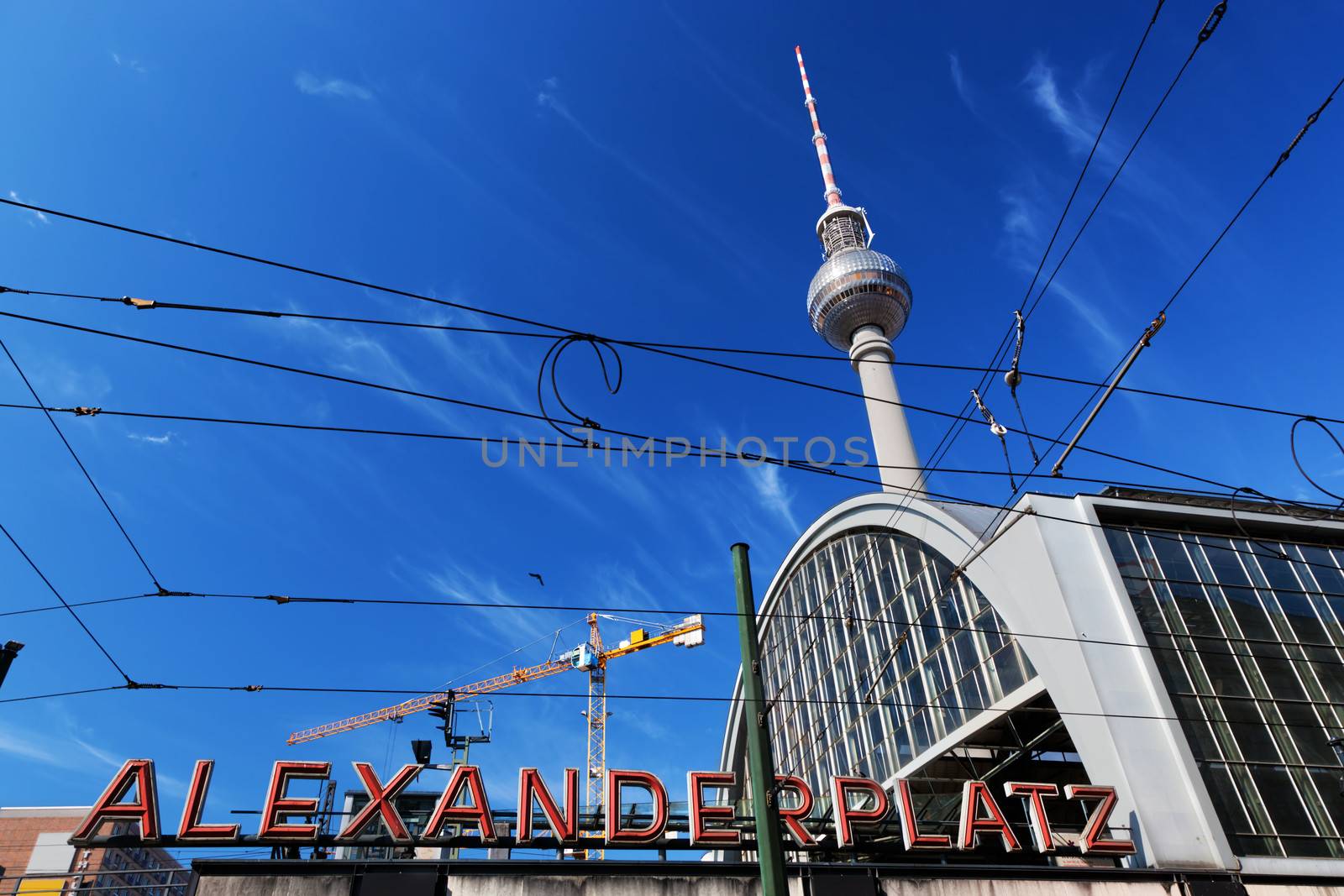 Alexanderplatz sign and Television tower. Berlin, Germany by photocreo
