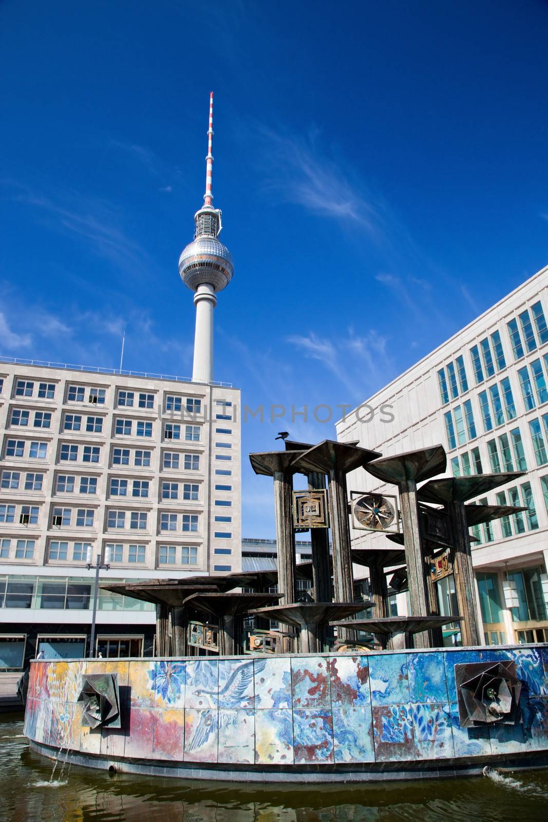 The fountain on Alexanderplatz. View on Television tower, German Fernsehturm. Berlin, Germany