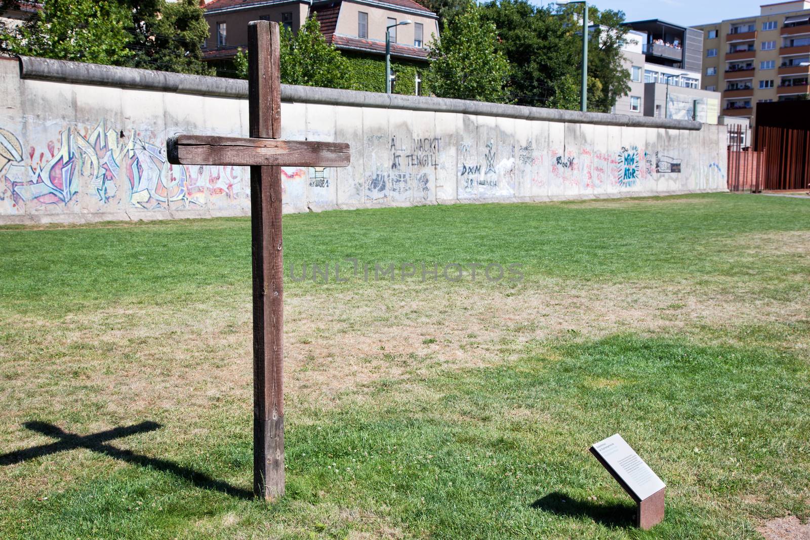 Berlin Wall Memorial with graffiti and cross commemorating the deaths and division. The Gedenkstatte Berliner Mauer 