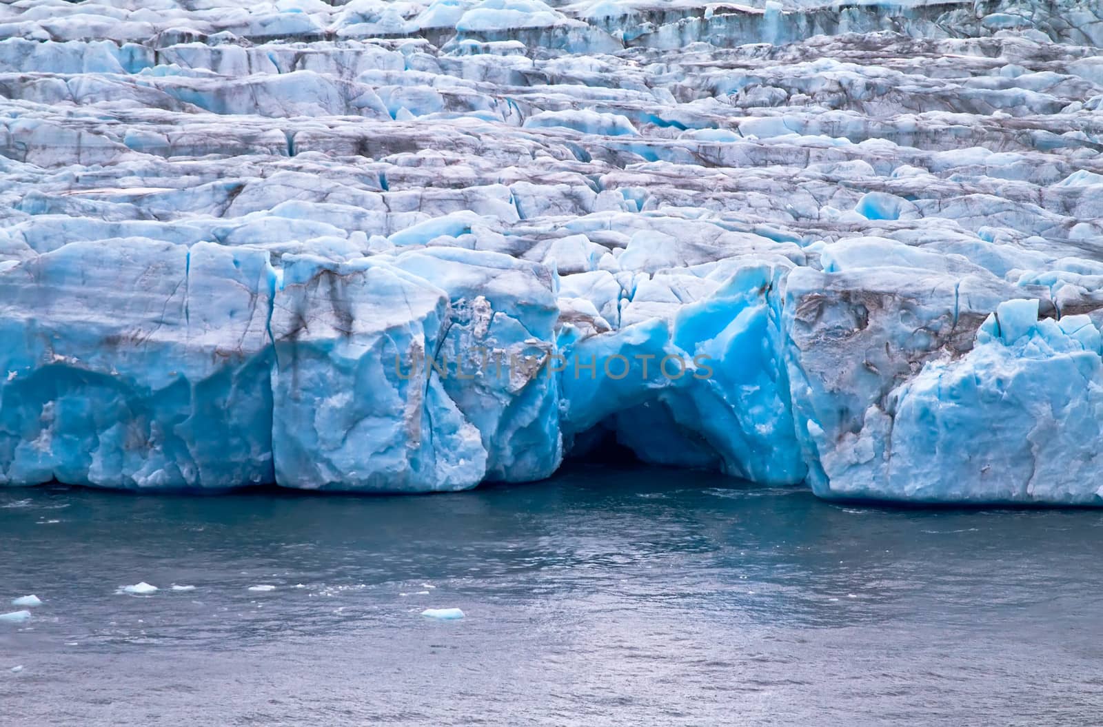 Blue grotto in a frontal wall of a glacier of Nansen. Northern island of Novaya Zemlya