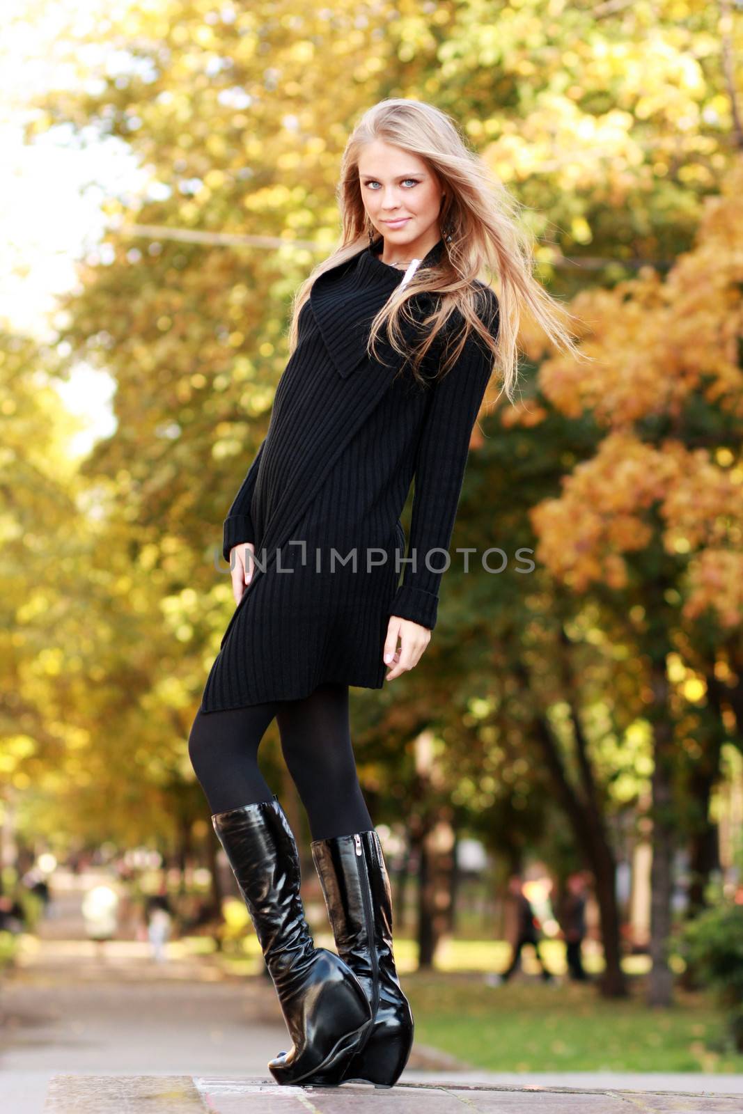 Beautiful woman walking in park by andersonrise