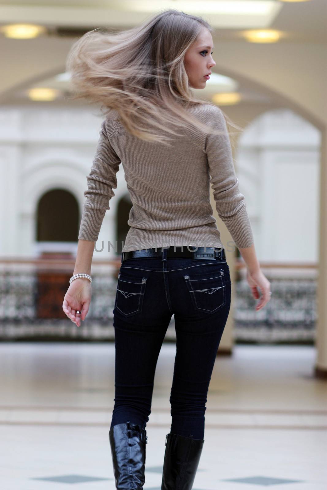 Beautiful blonde woman in shop by andersonrise