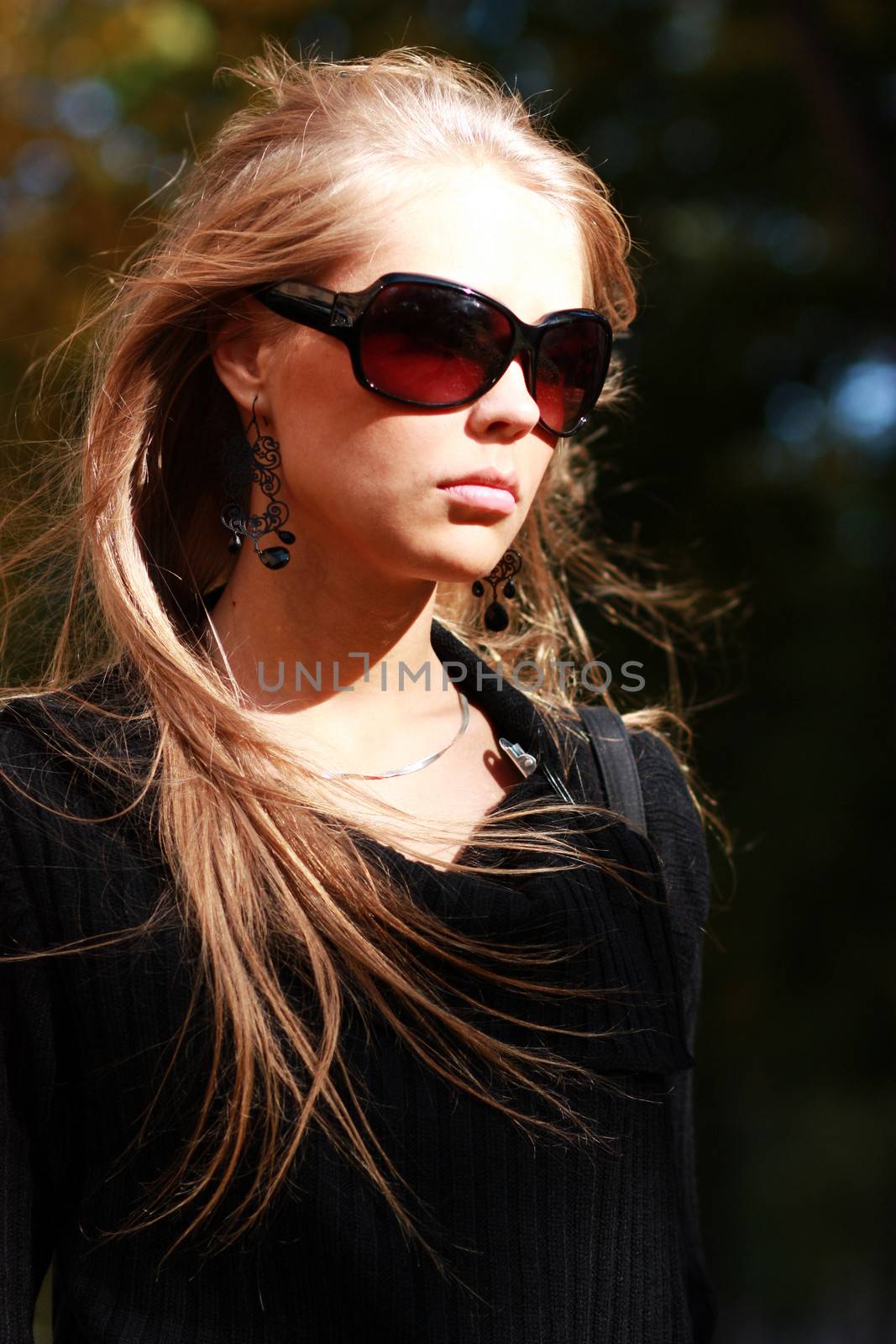 Beautiful young woman in sunglasses by andersonrise