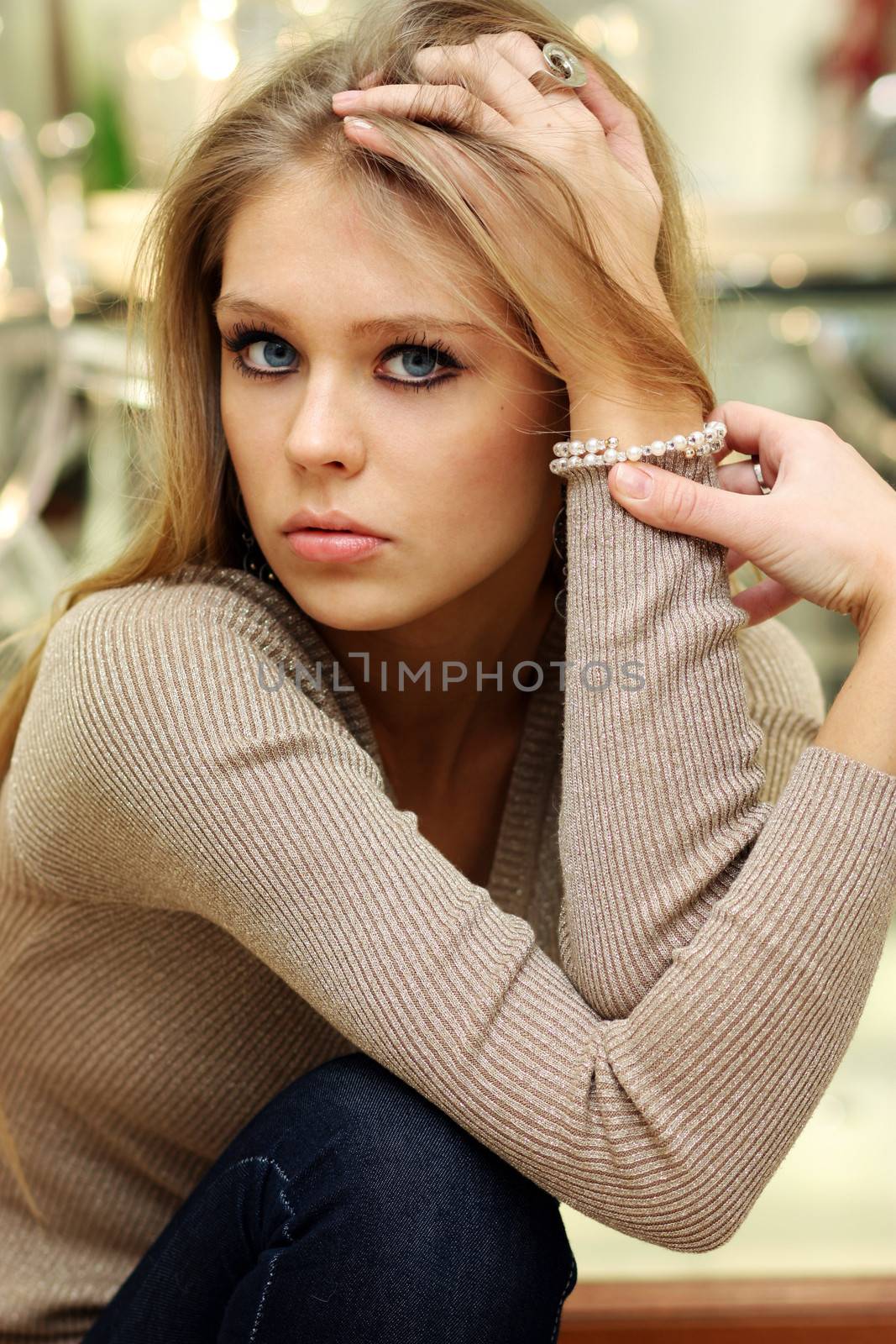 Portrait of young beautiful blond woman by andersonrise