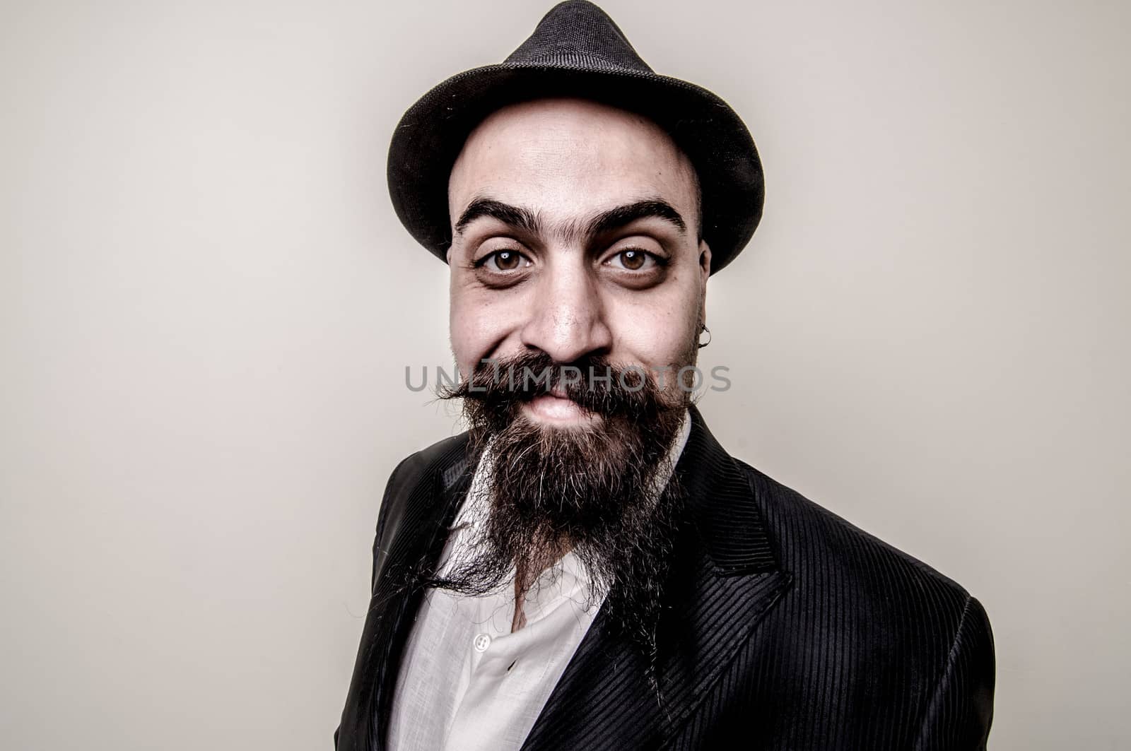 long beard and mustache hipster with elegant suit 