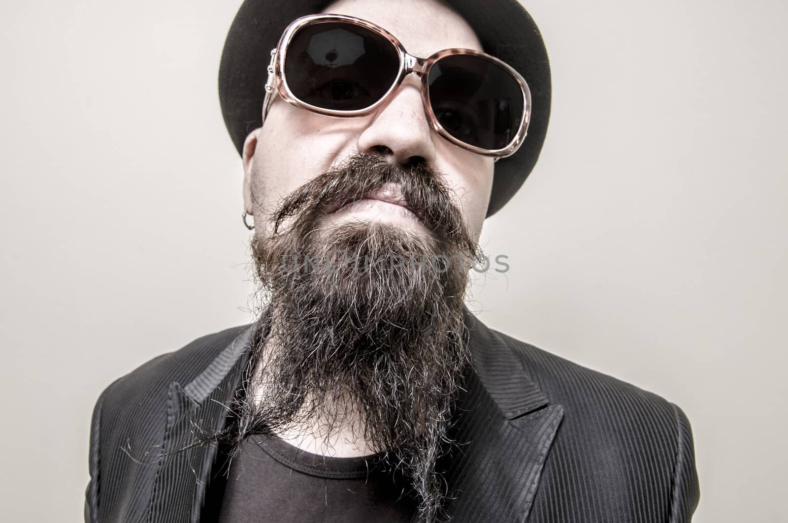 long beard and mustache hipster with elegant suit 