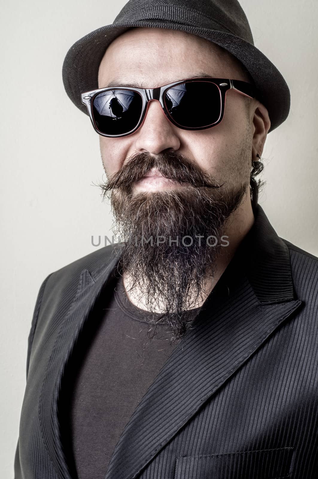 long beard and mustache hipster with elegant suit 