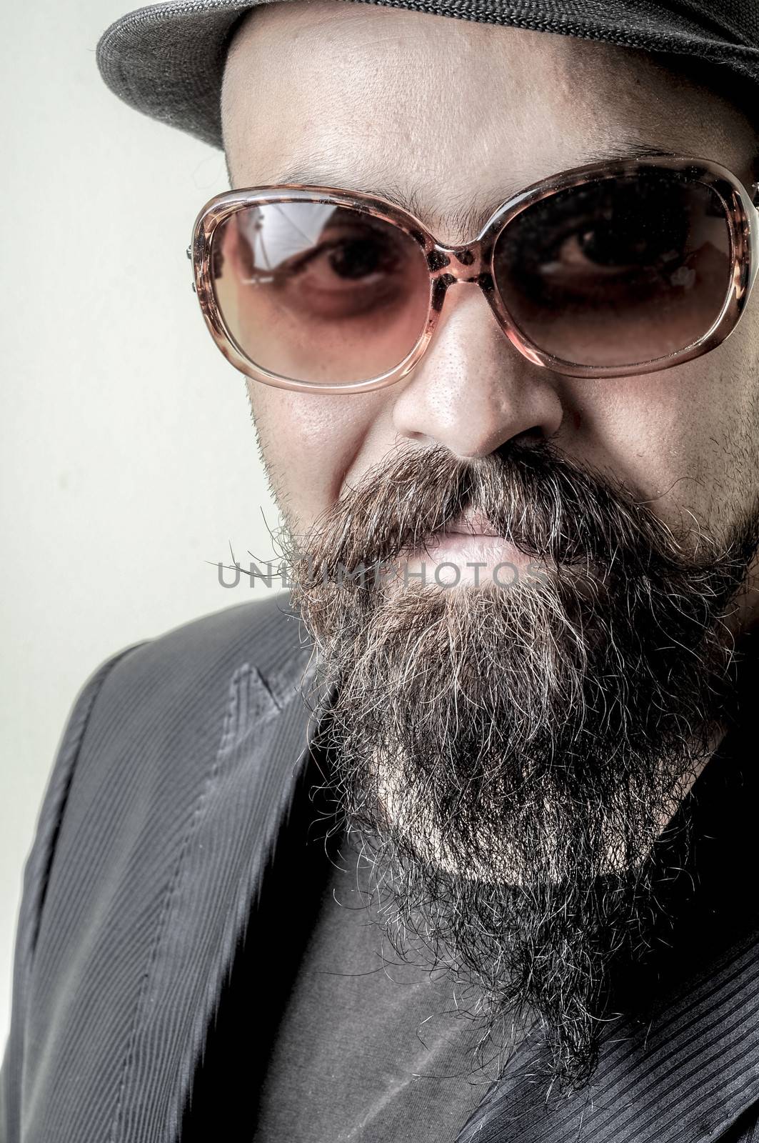 long beard and mustache hipster with elegant suit 