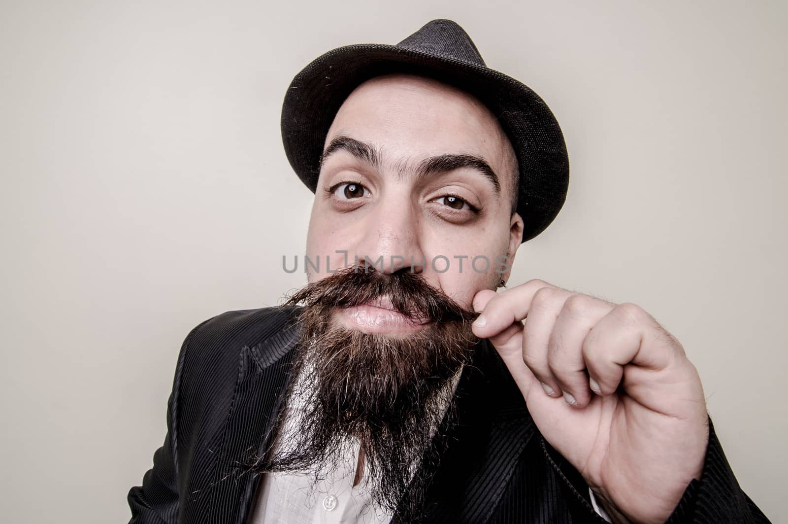 long beard and mustache hipster with elegant suit 