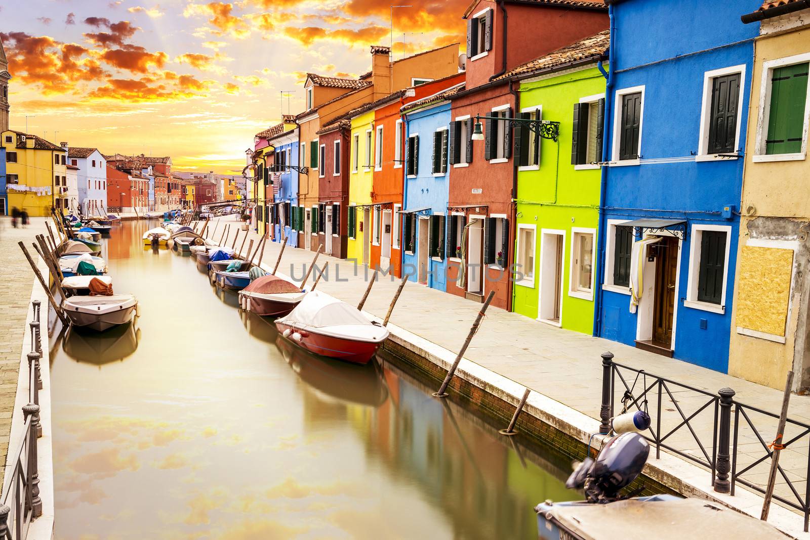 Colorful buildings in Burano island sunny street, Venise, Italy