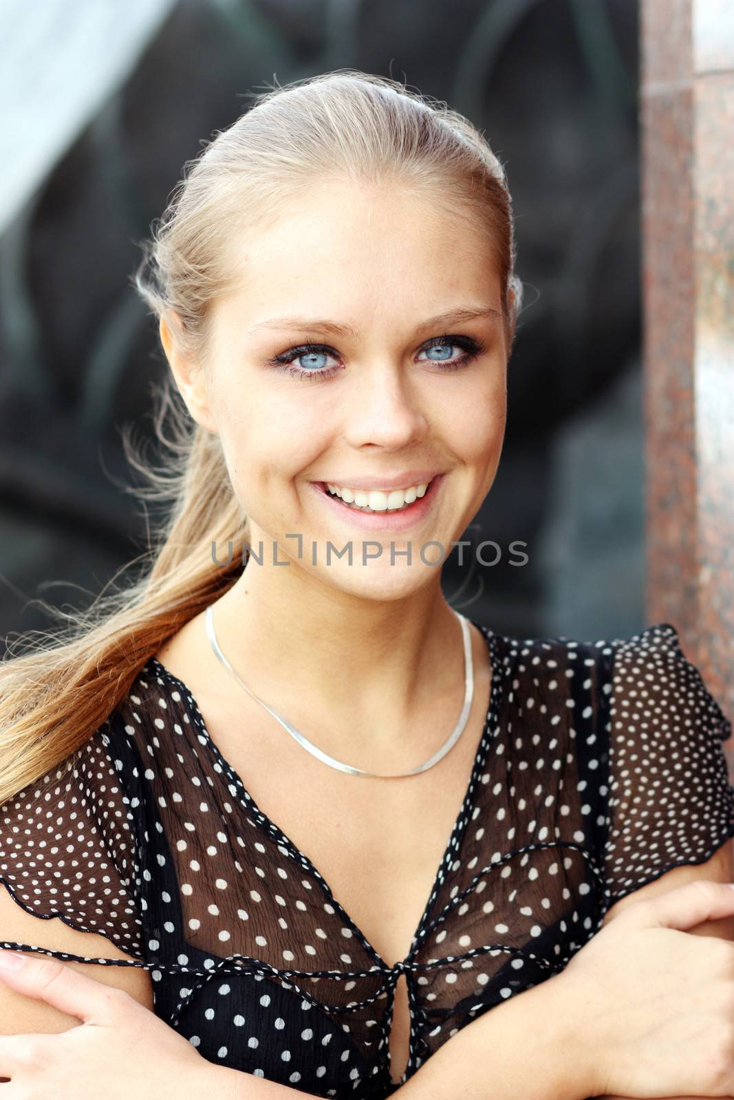 Beautiful young blonde woman. Outdoor portrait