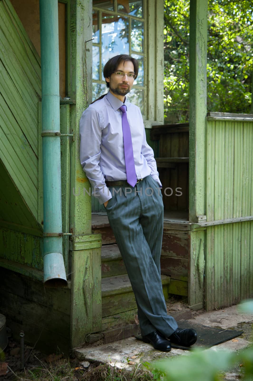 thinking Manager in the glasses in the old house