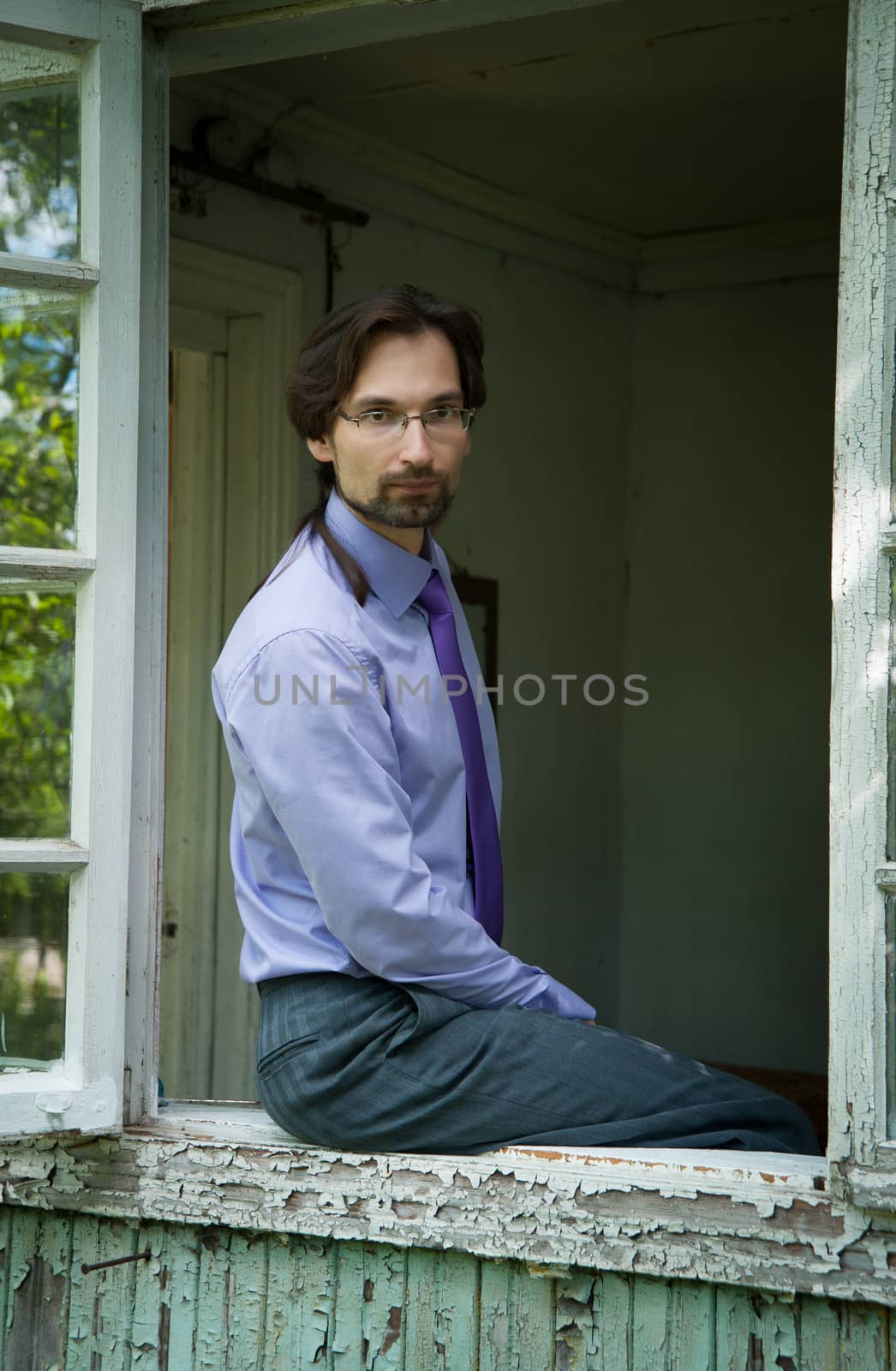 thinking Manager in the glasses in the old house