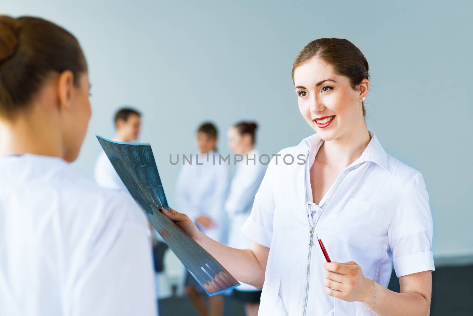 Doctor talking with a colleague, collaboration in medicine