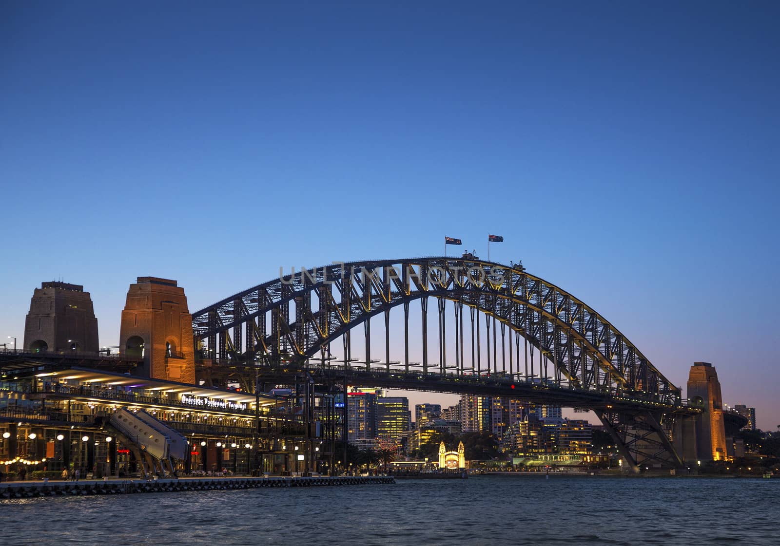 sydney harbour bridge in australia at night by jackmalipan