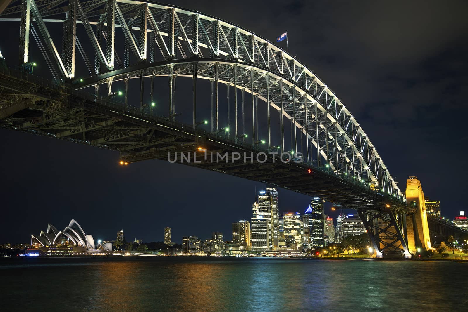 sydney harbour bridge in australia at night by jackmalipan