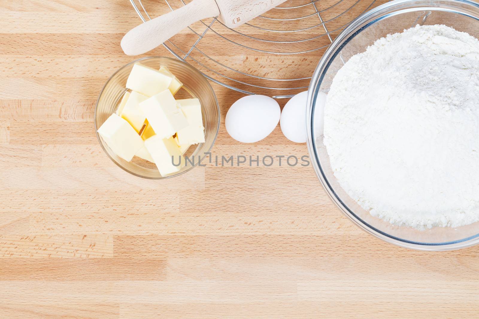baking ingredients from top on wooden background