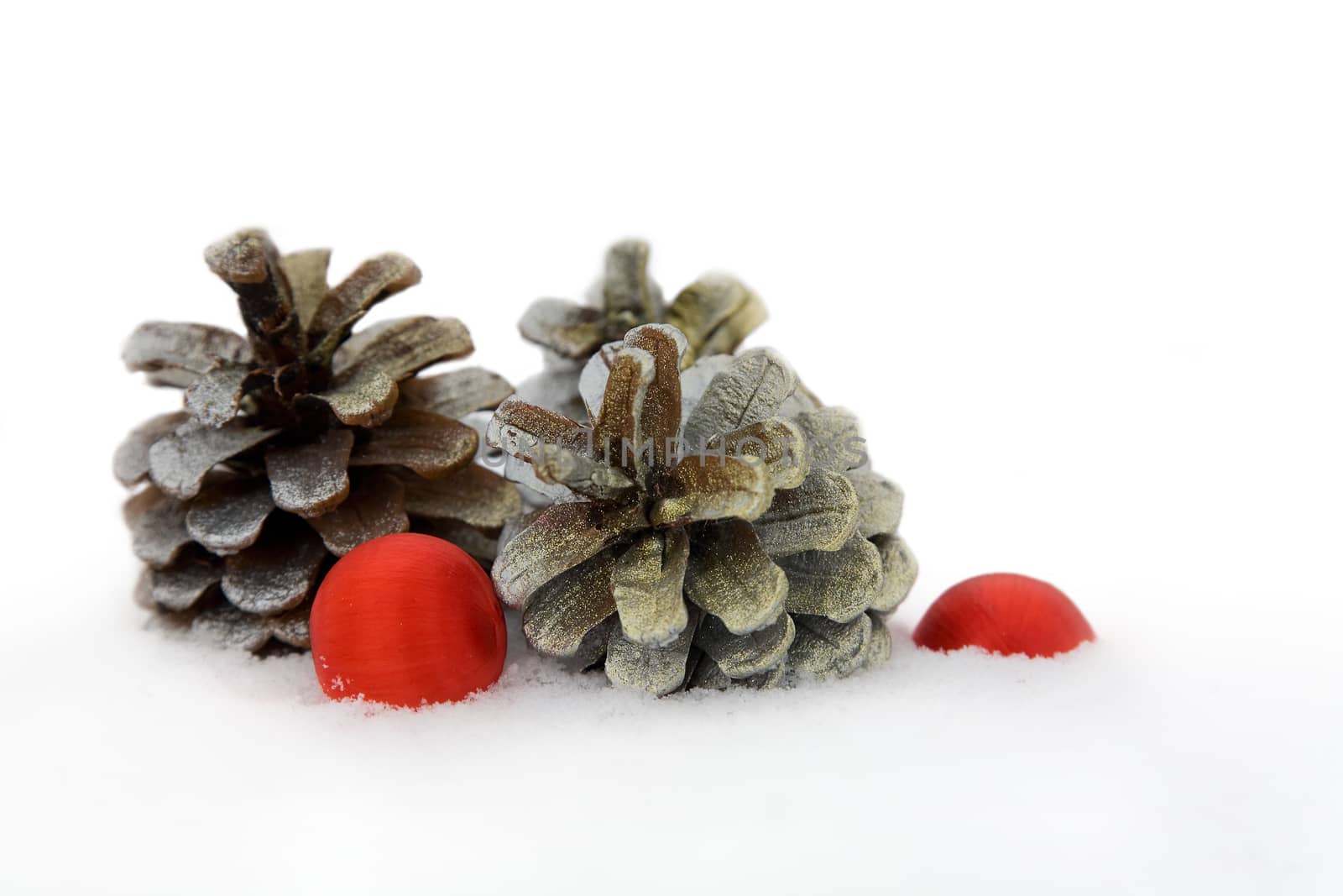 fir cone and Christmas ball on snow background