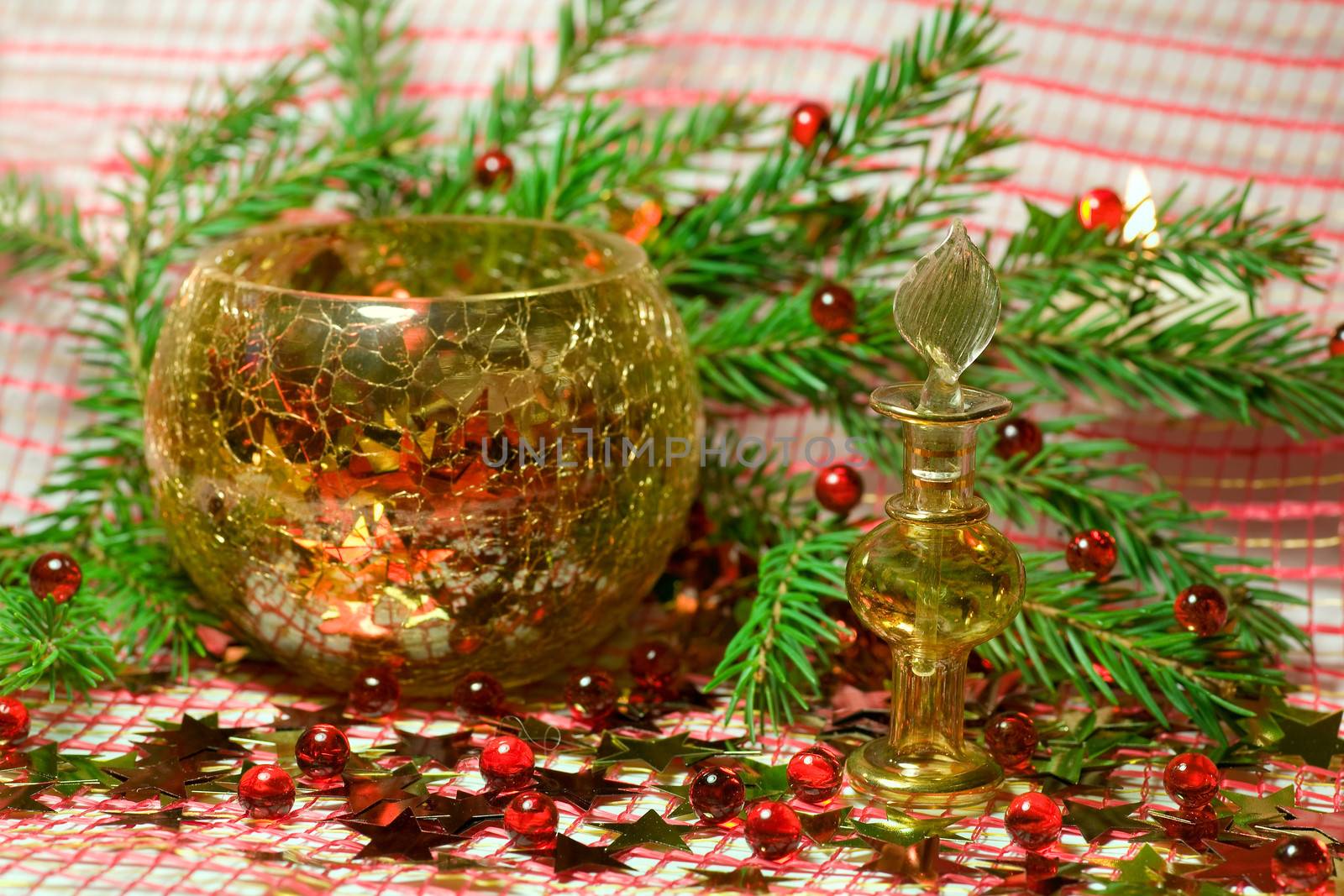 Christmas composition with  bottle,  stars  and branch of spruce