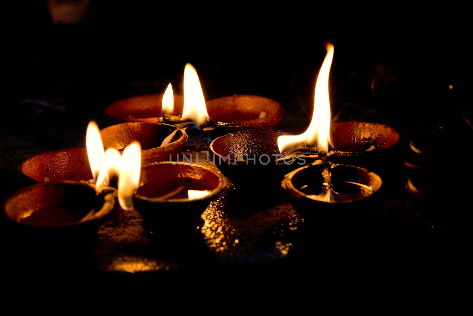 Burning candles on altar  in buddhist temple, Sri Lanka 
