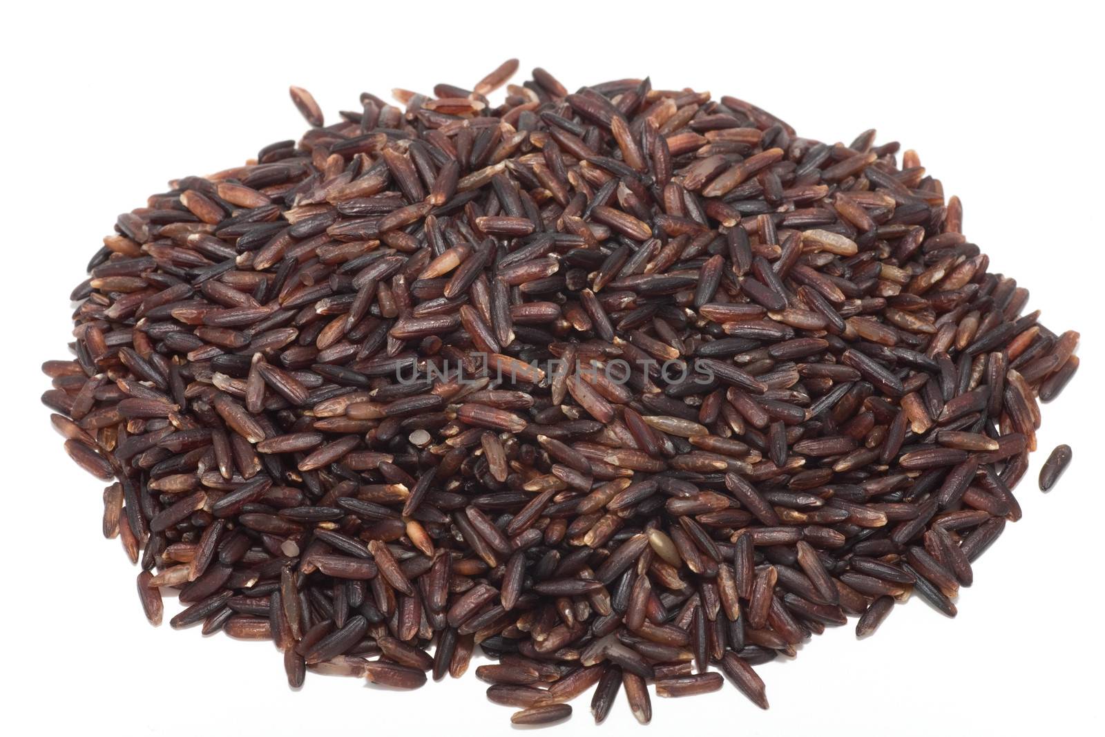 Mound of raw wild rice isolated on white background 