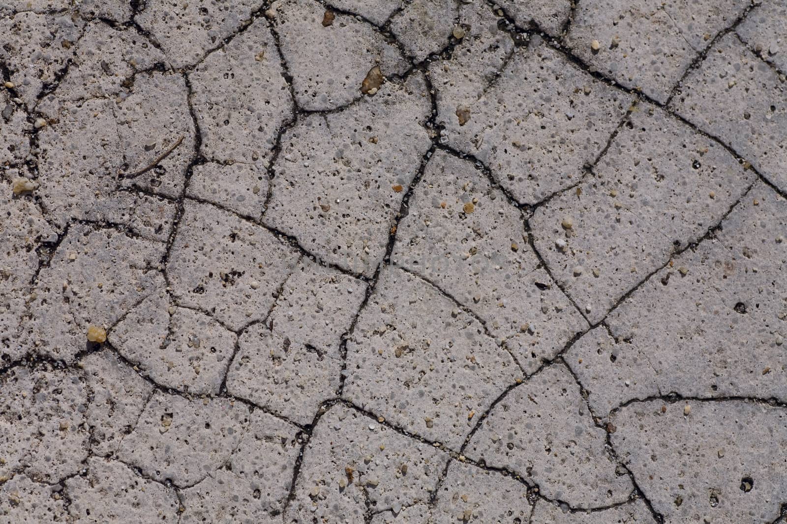 gray Cracked stone abstract texture on road