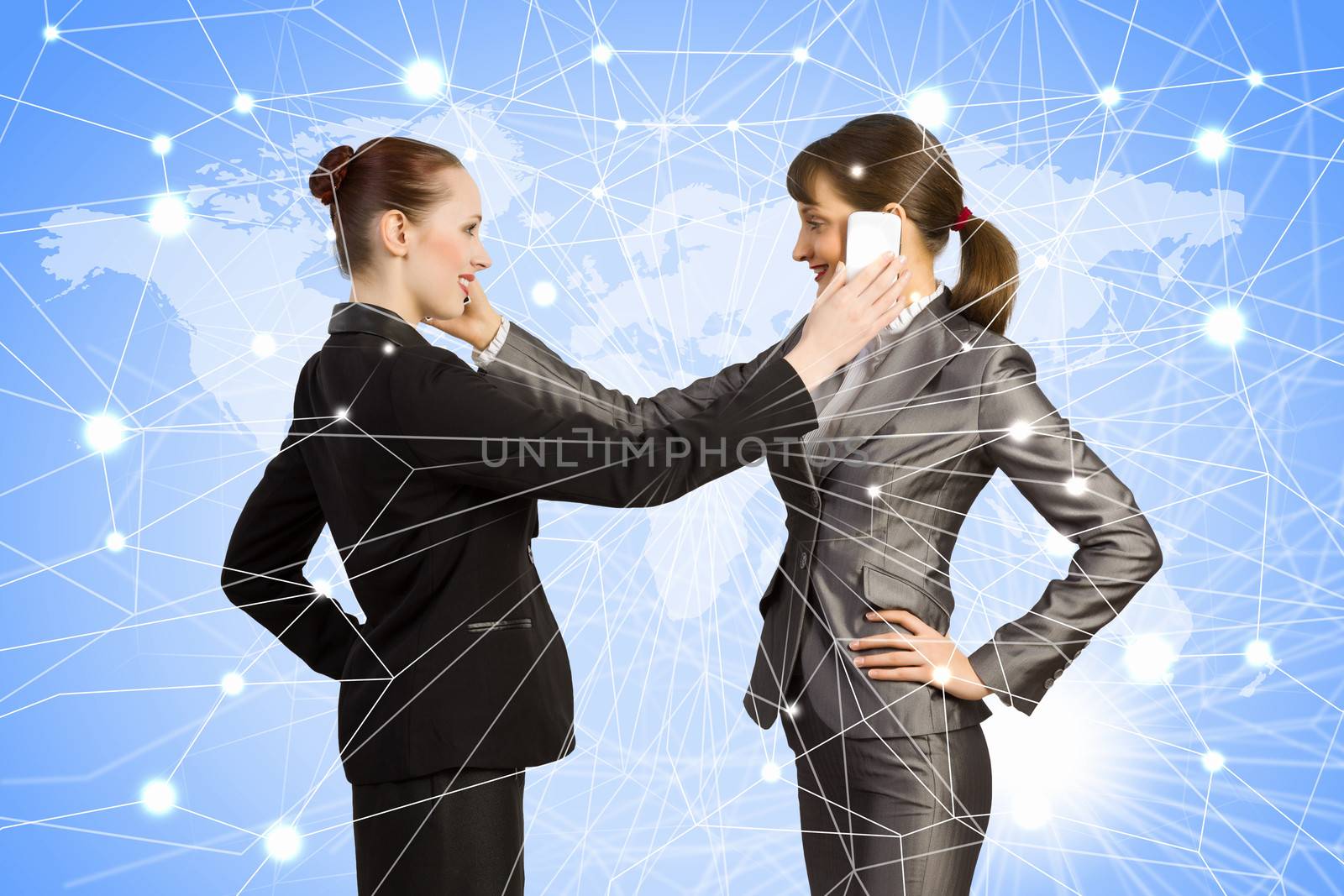 Two businesswomen talking on mobile phone. Cooperation concept
