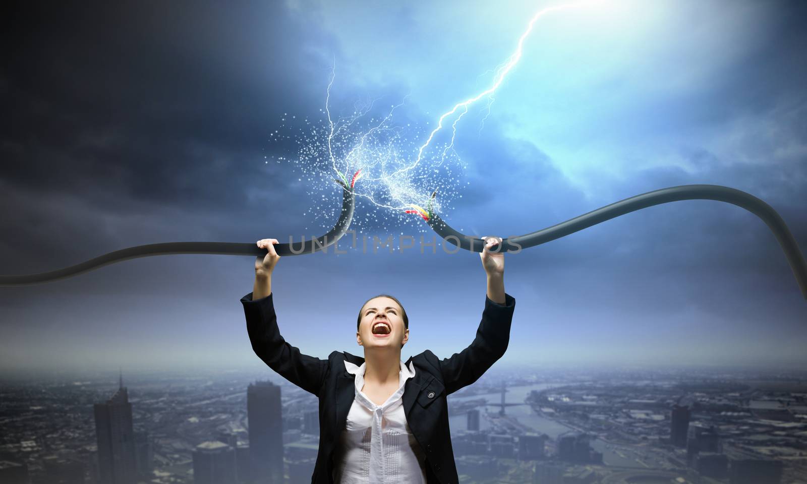 Image of businesswoman holding electrical cable above head