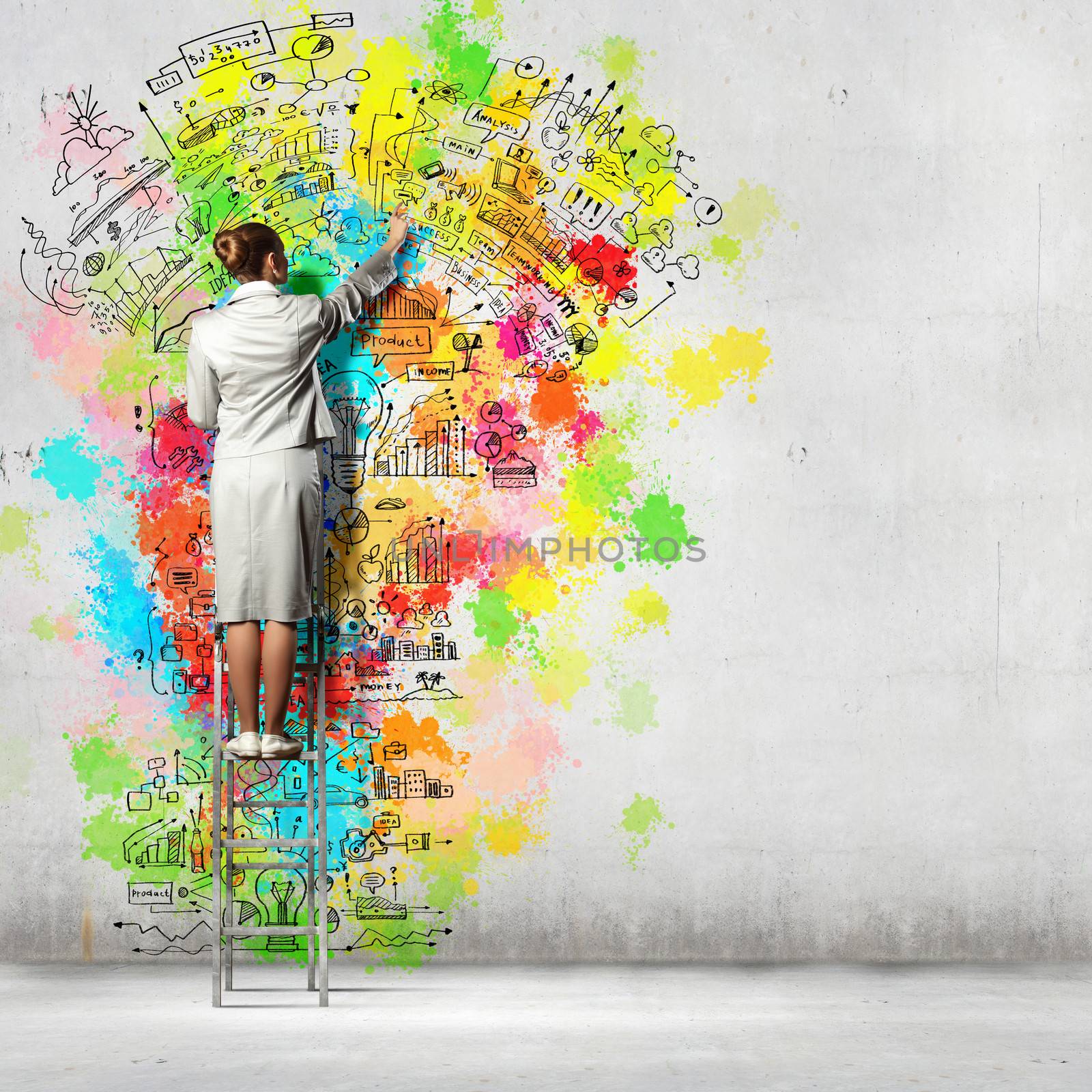 Back view of businesswoman drawing colorful business ideas on wall