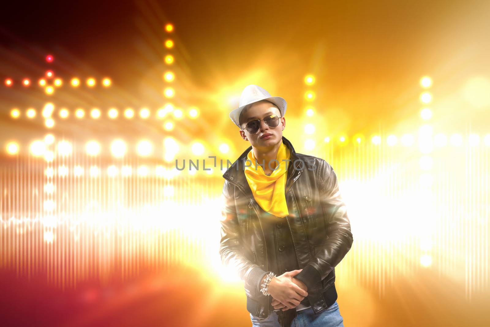 Young man, rock musician in jacket with guitar