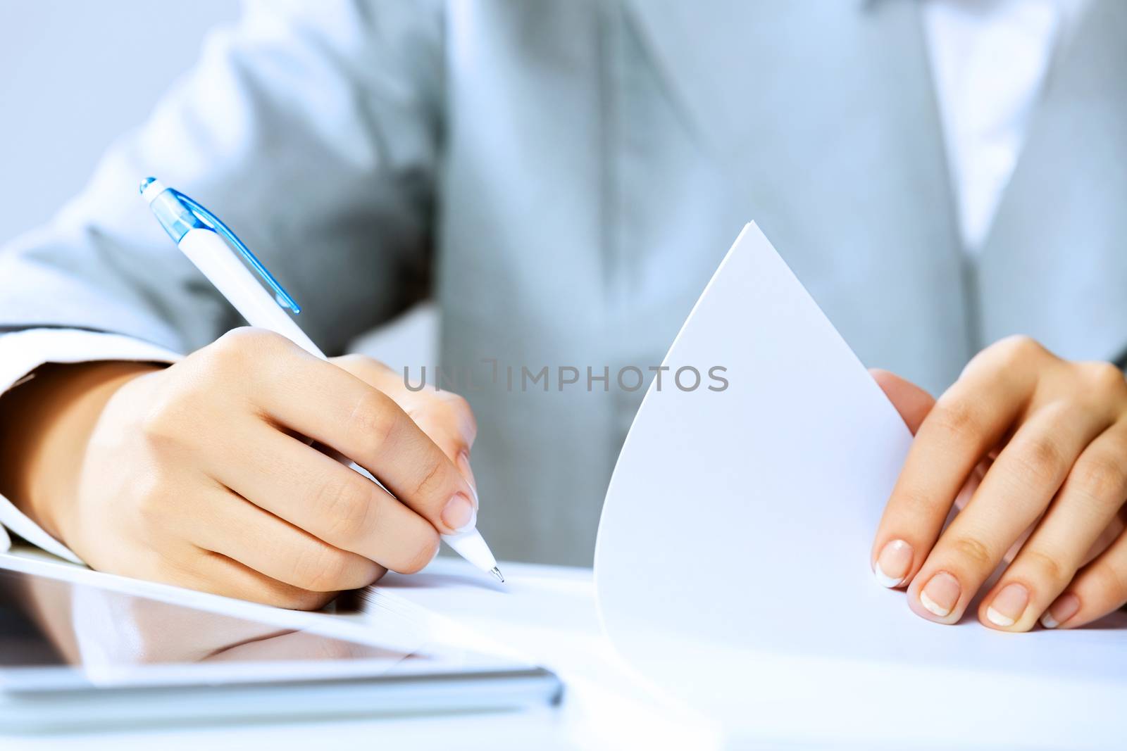 Close up image of businesswoman hands signing documents