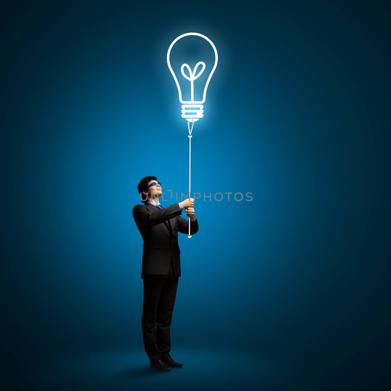 Image of businessman with bulb balloon. Inspiration concept