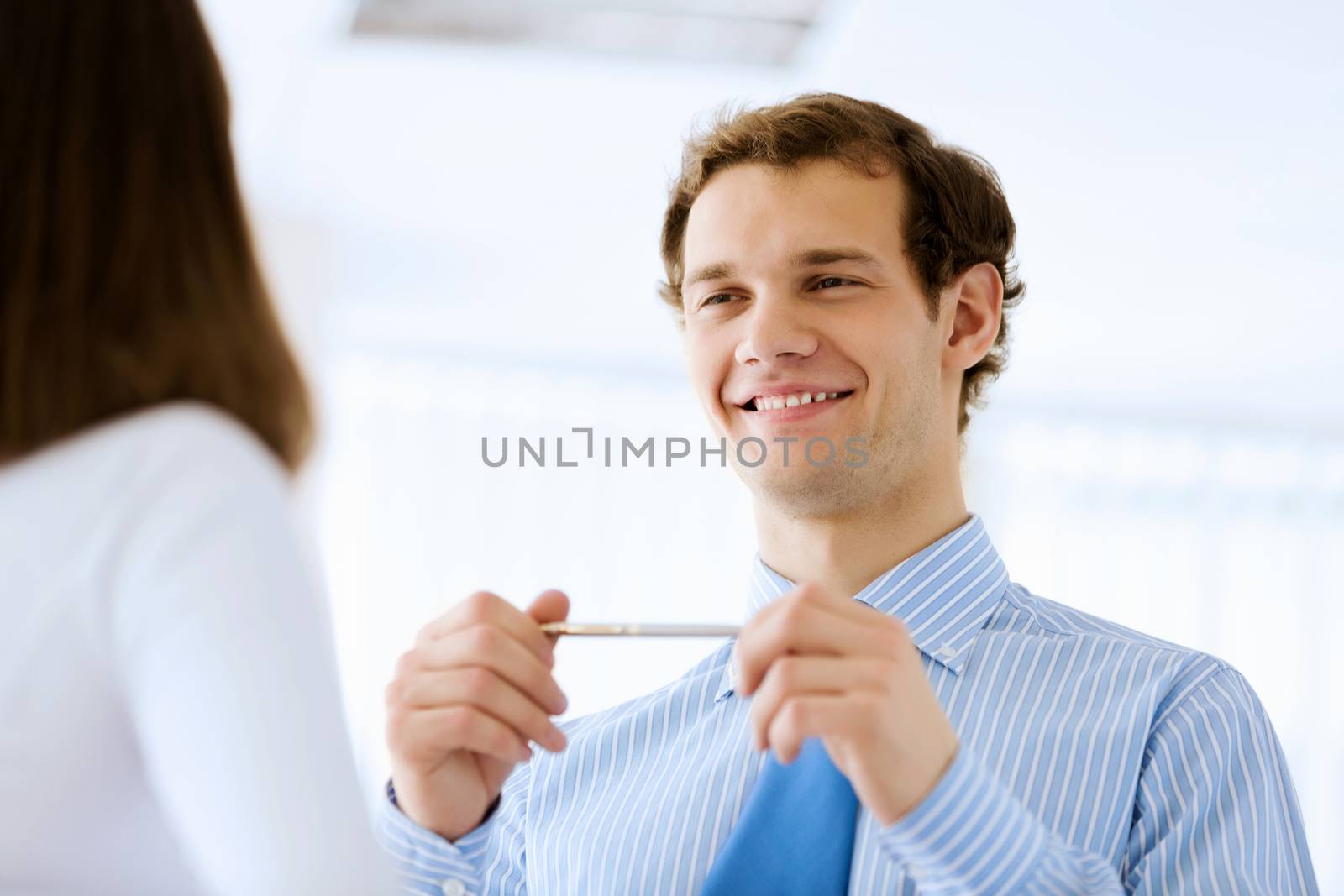 Image of young handsome confident businessman in suit