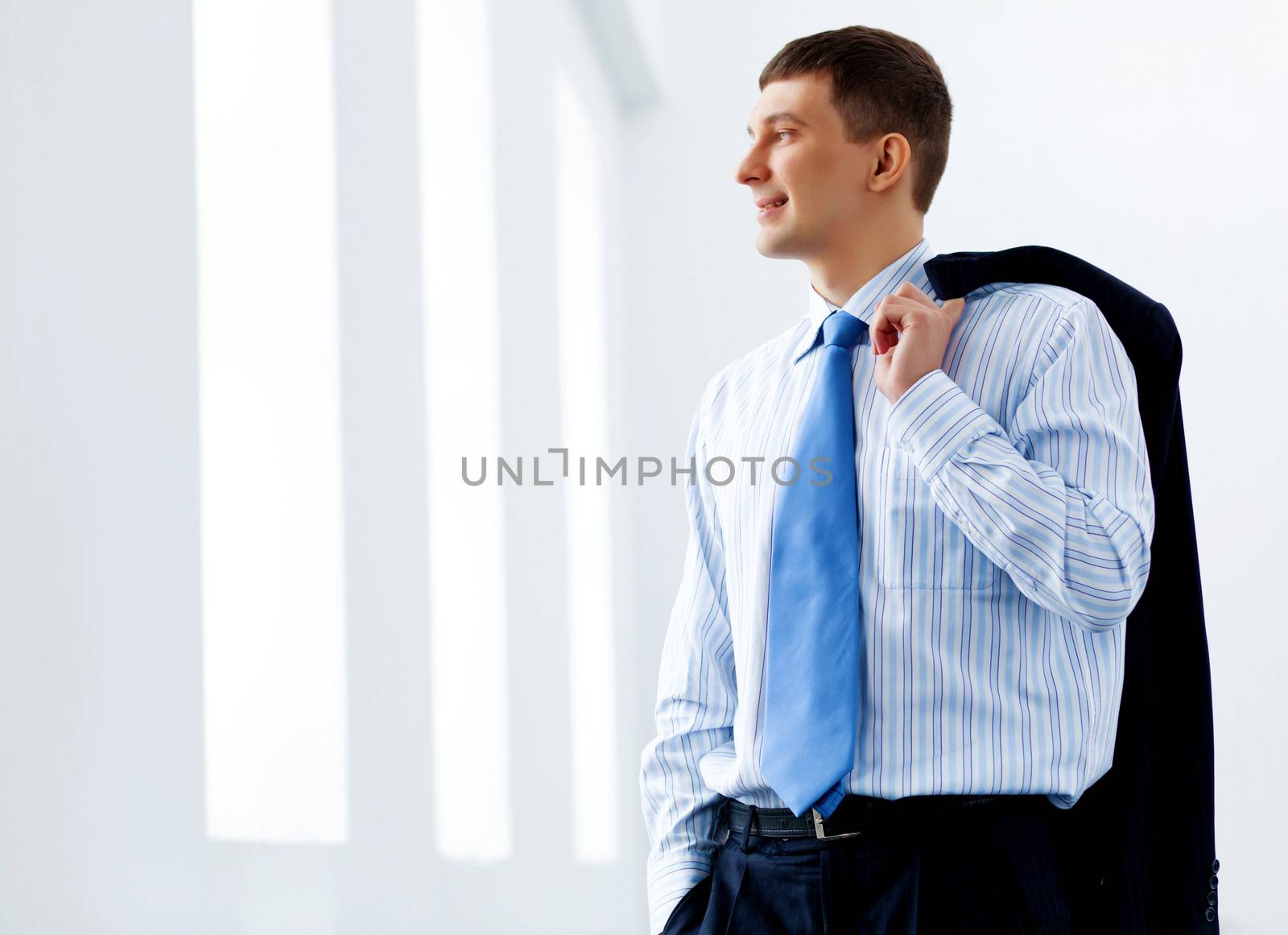 Image of handsome businessman smiling wearing business suit