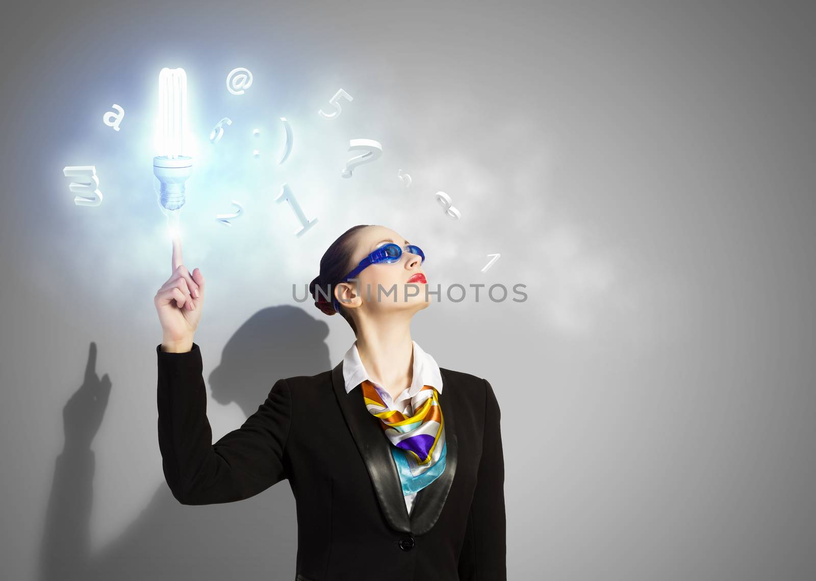 Image of businesswoman in goggles with business collage at background. Idea concept