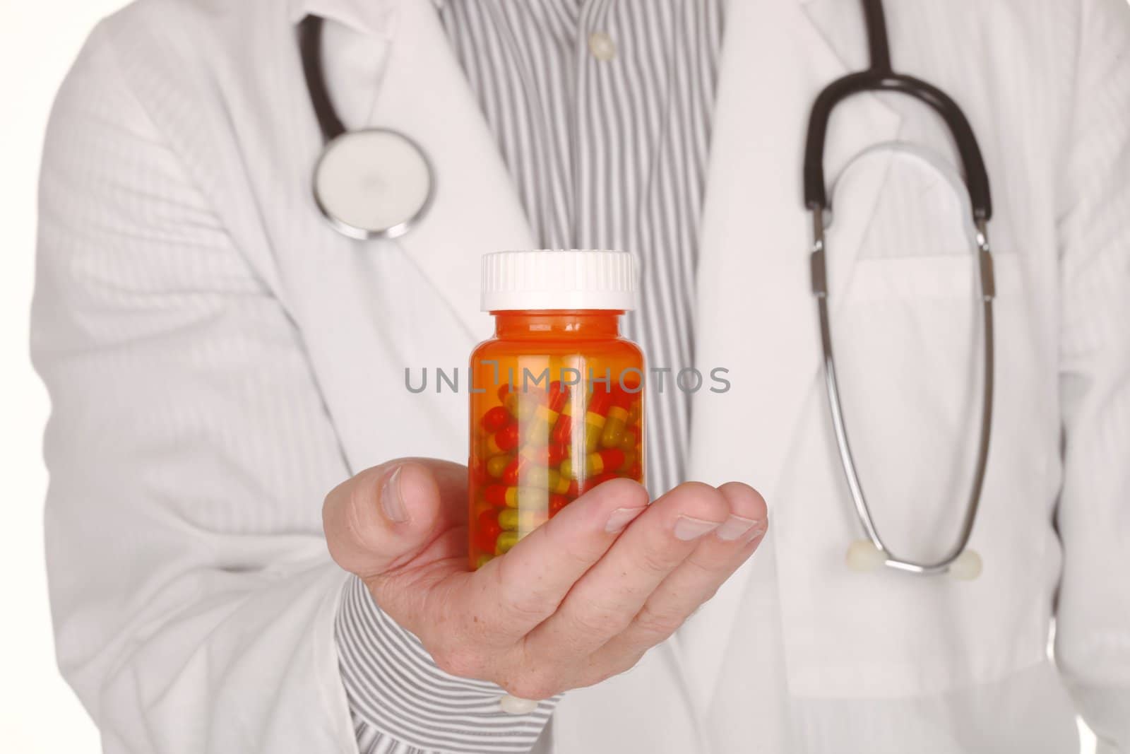 Doctor With Medication in Prescription Bottles by tobkatrina