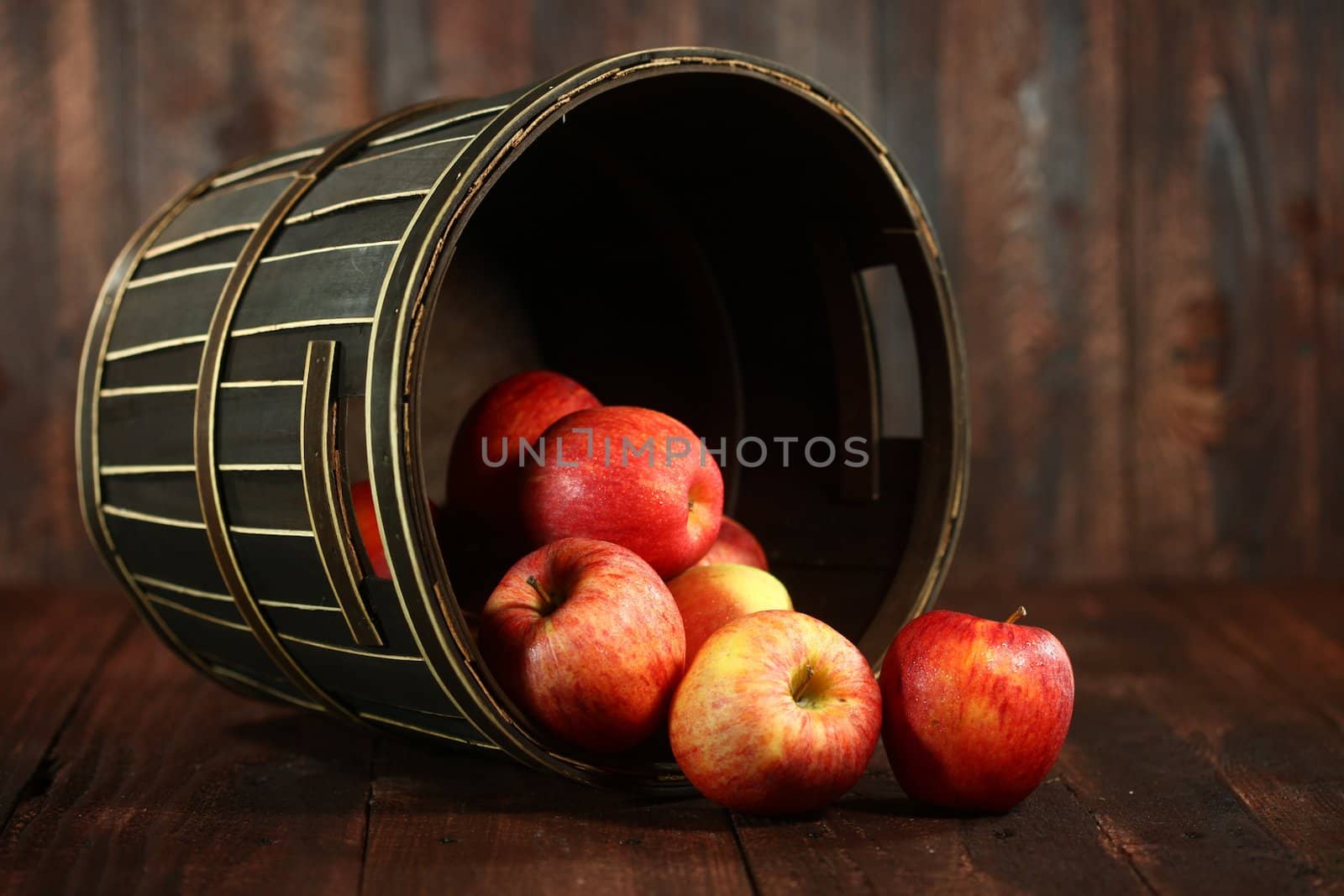 Barrel Full of Red Apples on Wood Grunge  Background by tobkatrina