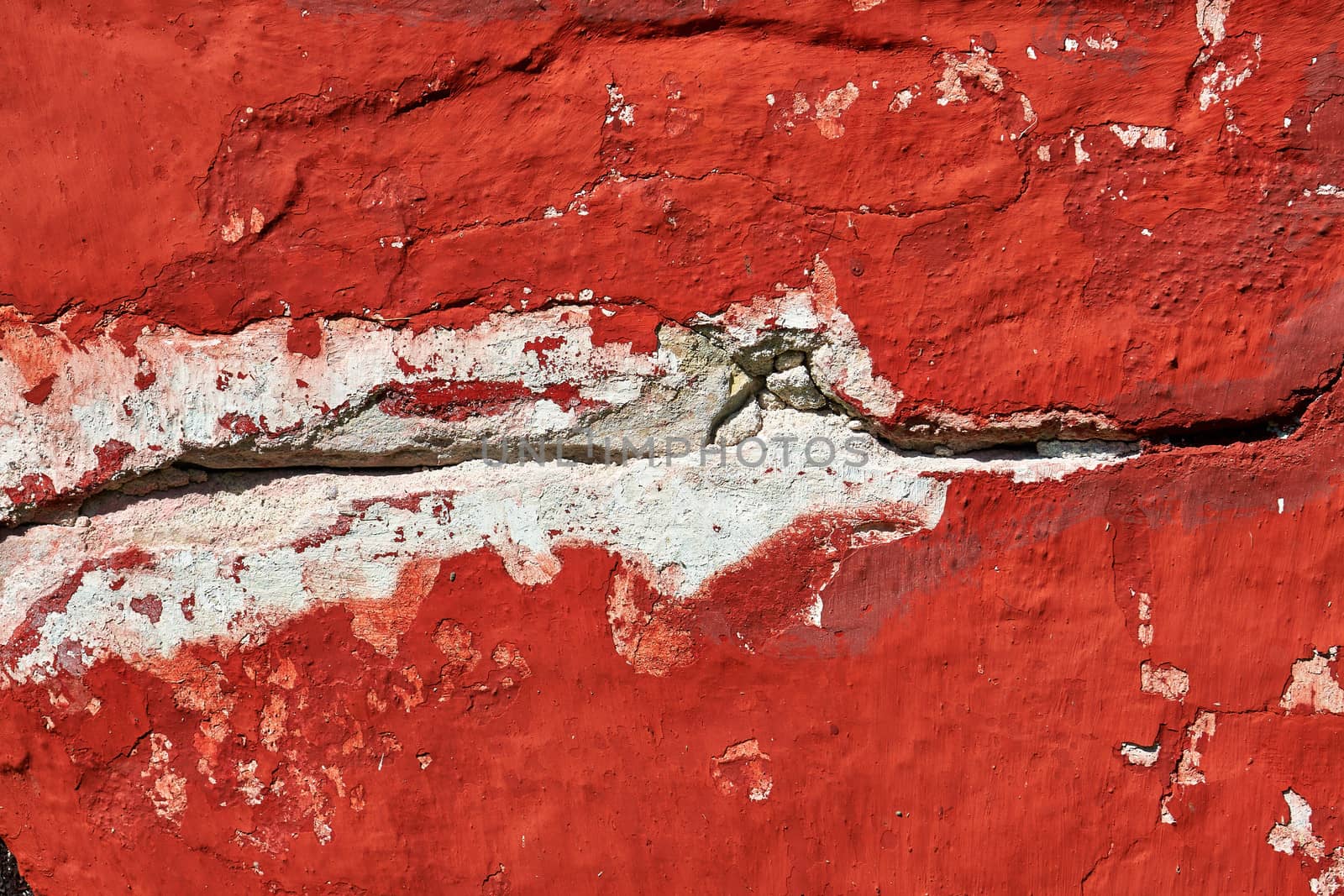  Closeup details of a red old cracked wall grunge background                              