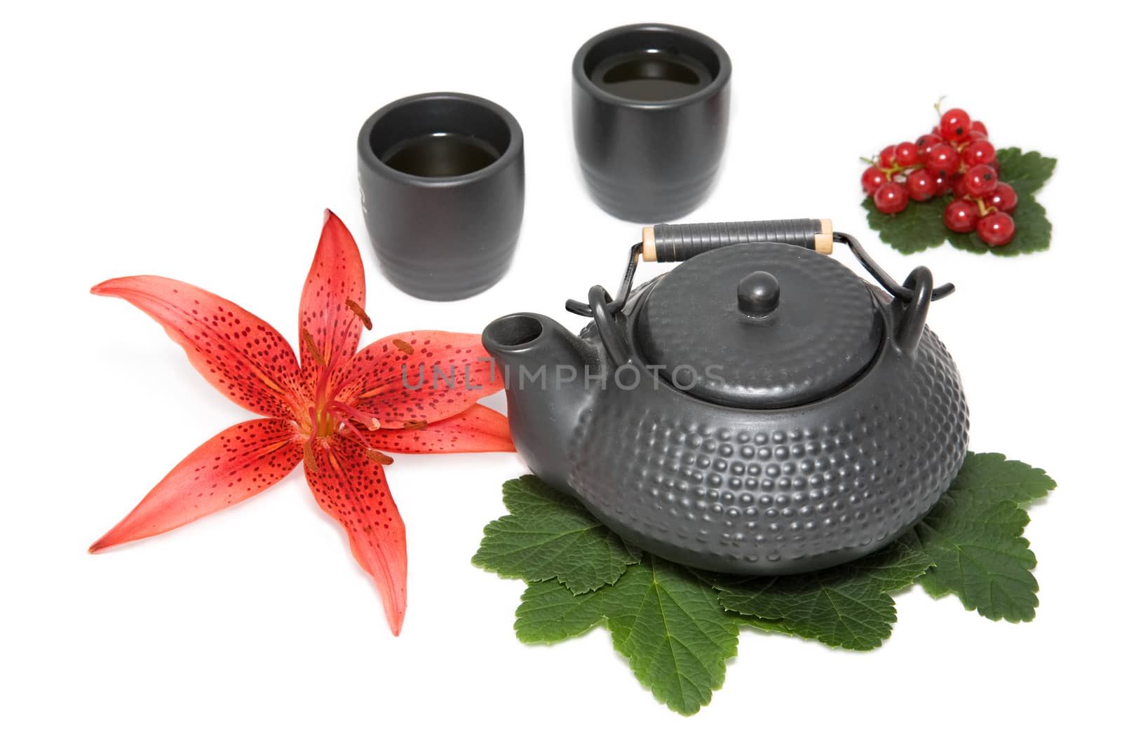 teapot and two cup with flower of  red lily and  wineberry