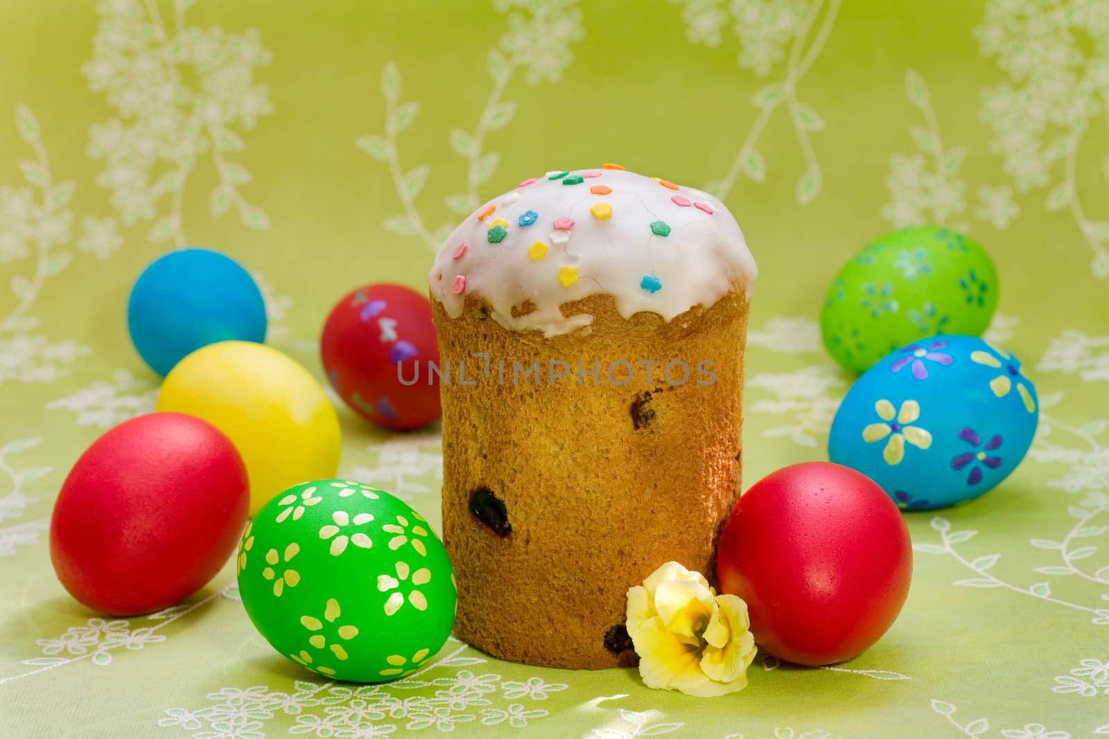 Easter cake with glace icing and colored easter eggs 