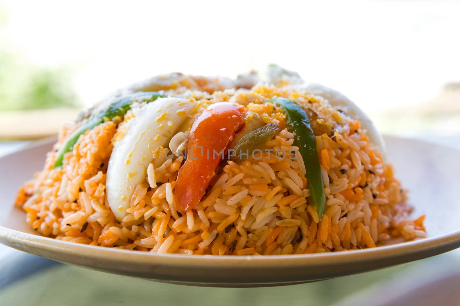 fried rice with vegetables, curry and seafood on the  plate 