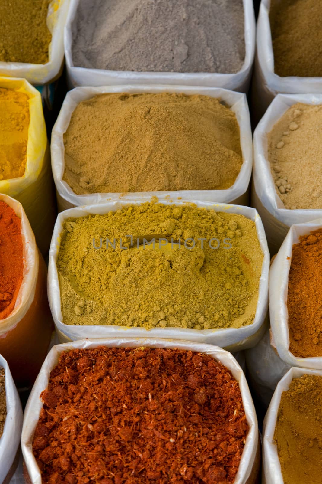 piles of Indian powder spices by foryouinf