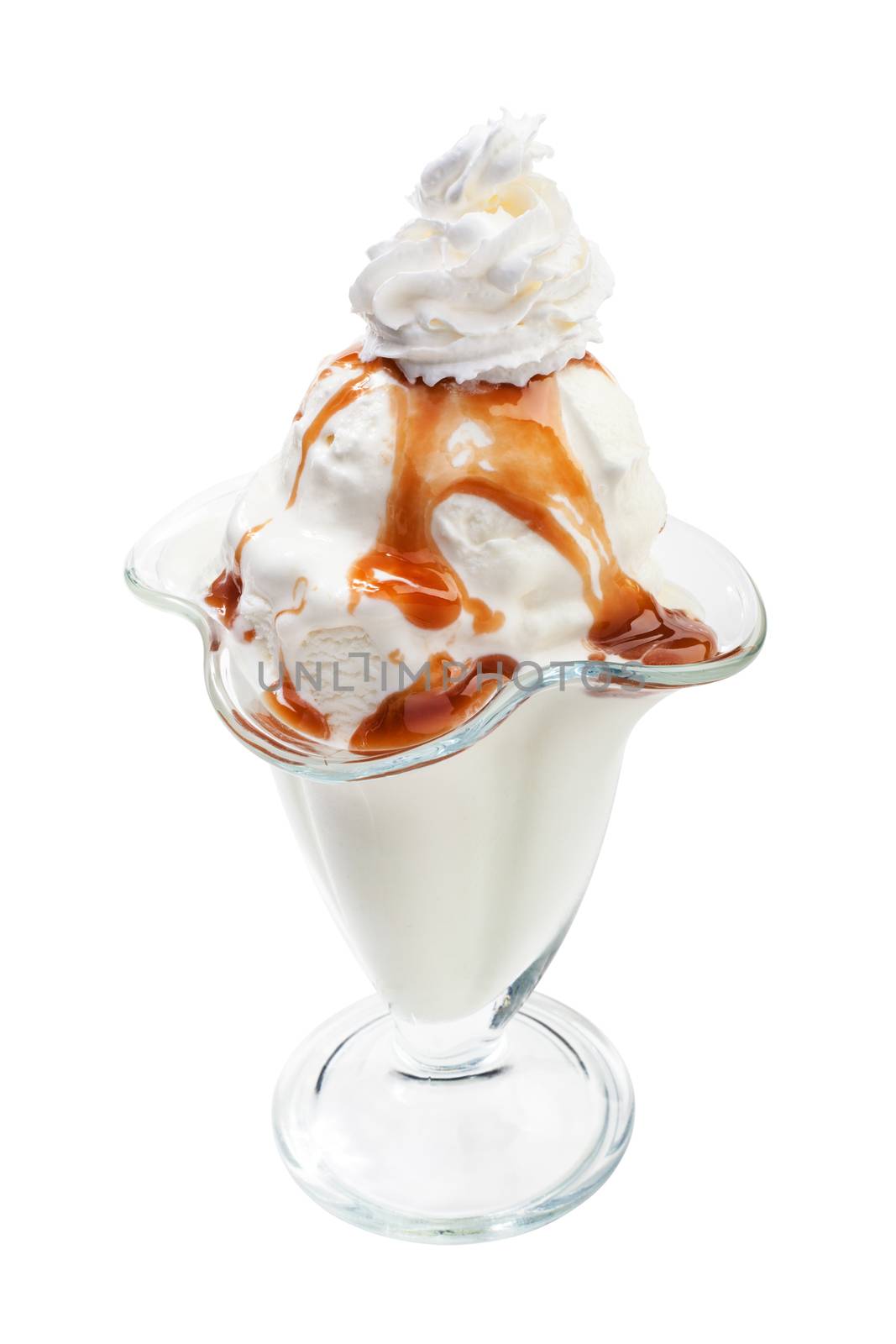 Bowl of ice cream under the caramel topping with cream on top