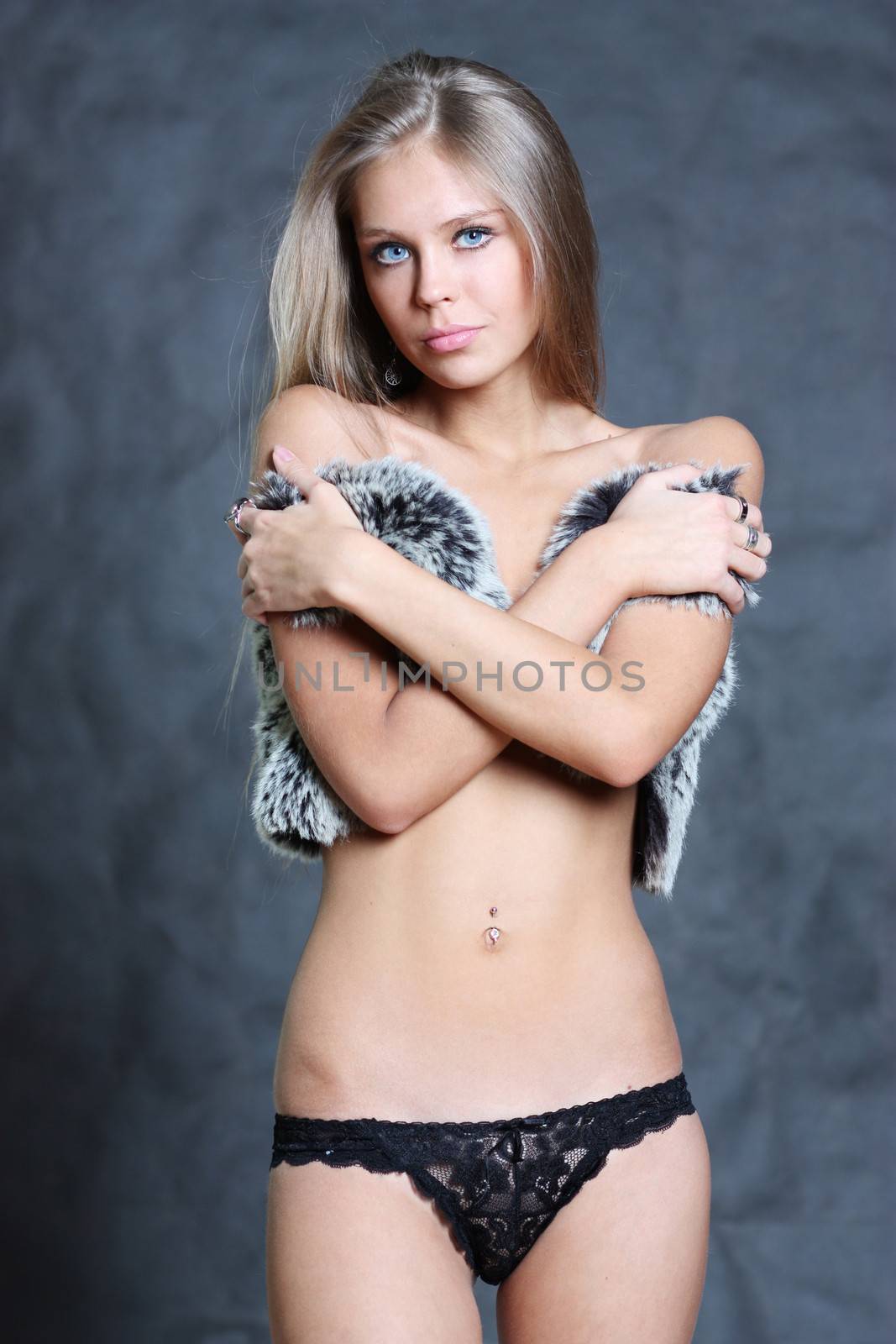 Sexy blonde woman, body on young female in soft light