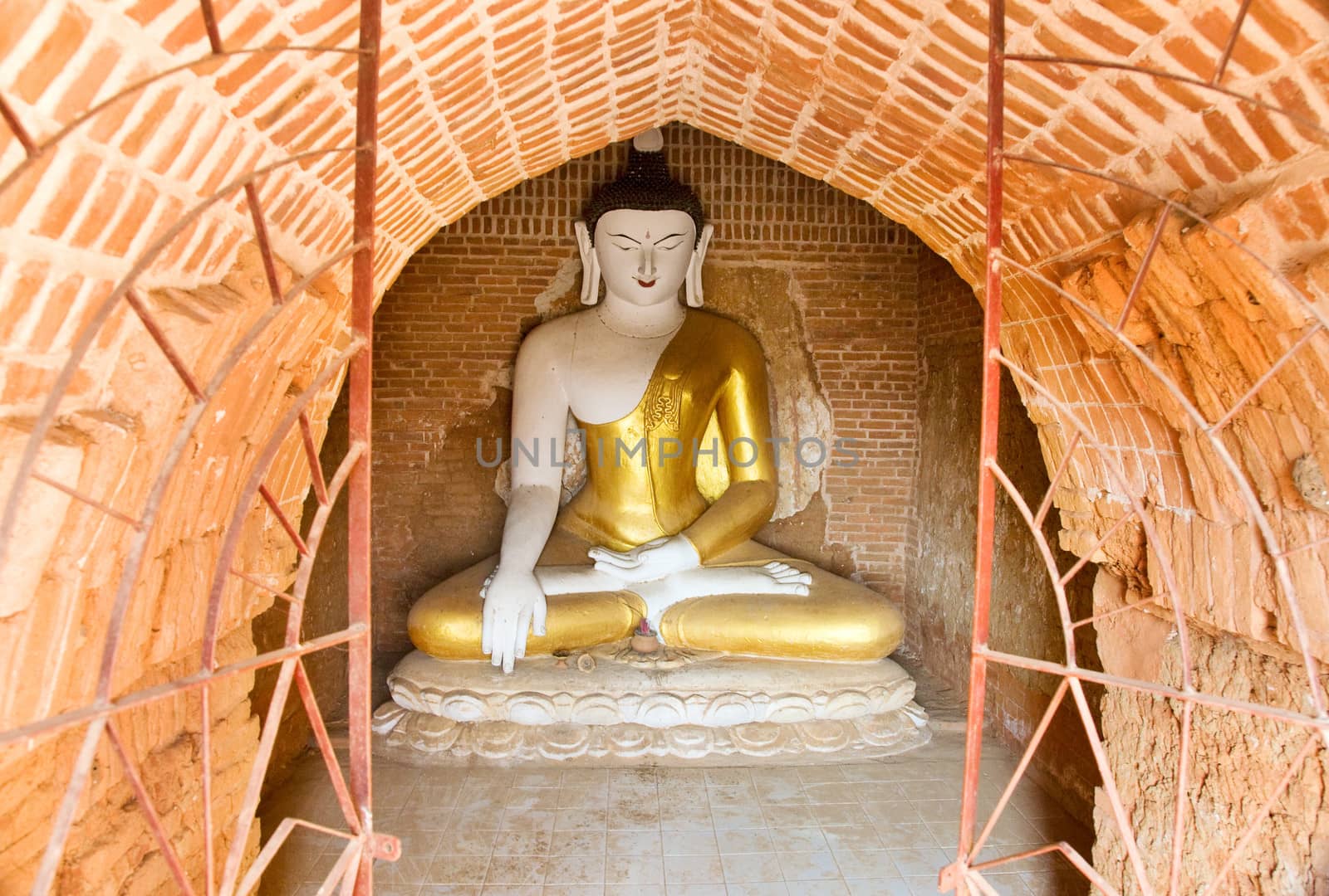 Stupa with statue of Buddha in Bagan, Myanmar