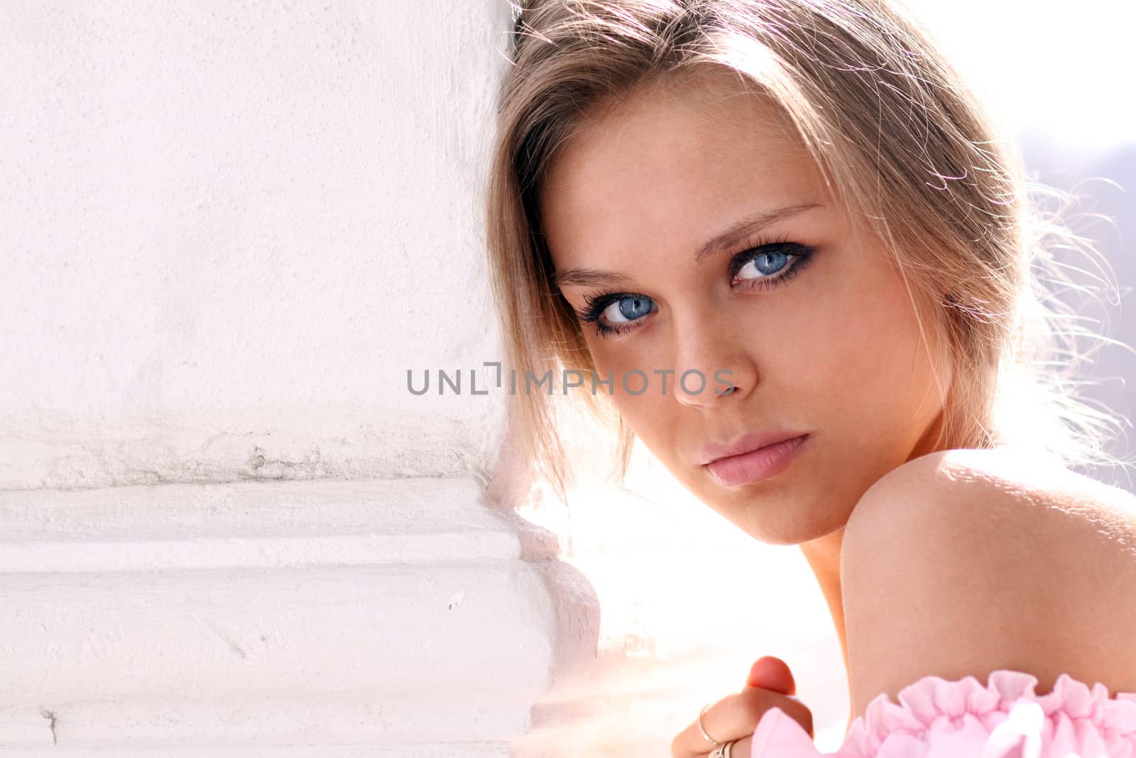 Beautiful young girl in pink dress