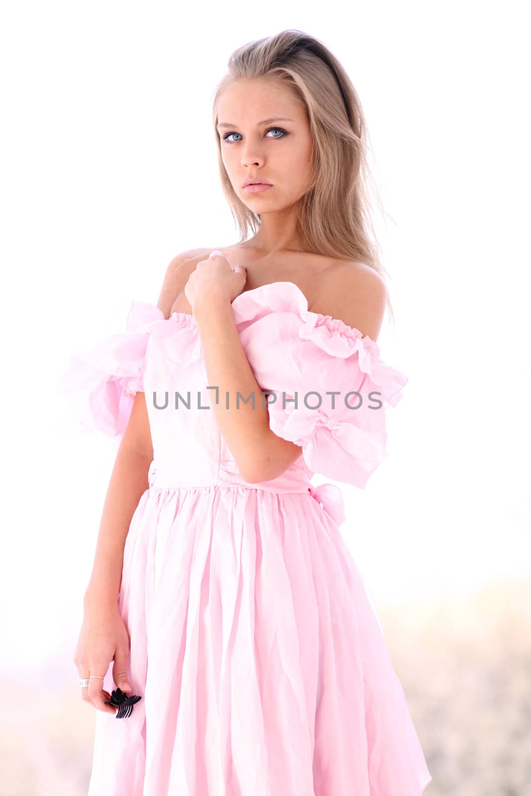Beautiful young girl in pink dress