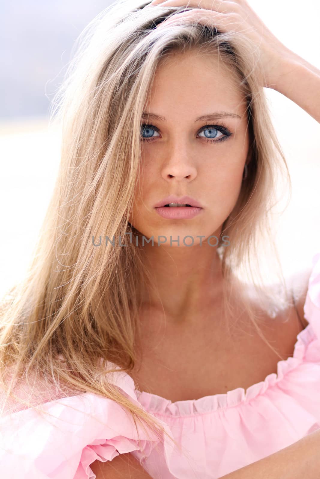Beautiful young girl in pink dress