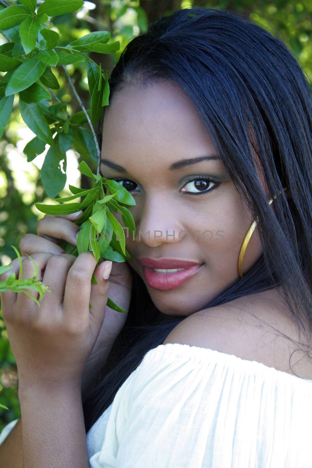 A close-up of a lovely young Haitian girl outdoors.